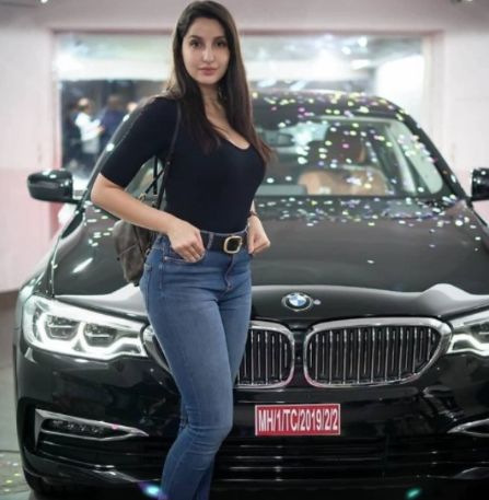 Nora Fatehi with BMW car