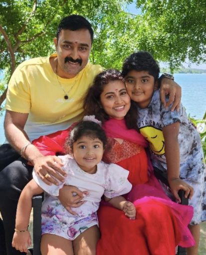 Sneha with husband and children